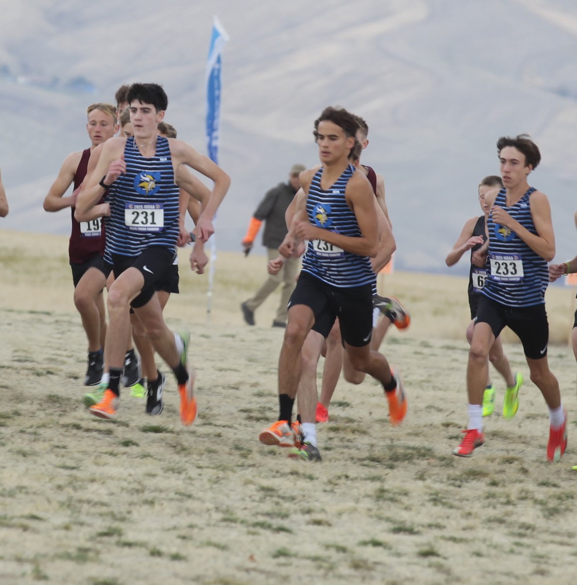 JASON ELLIOTT/Press
Coeur d'Alene's Wyatt Carr, Mitchell Rietze and Rowan Henry get off the starting line in Saturday's state 6A boys cross country race at Lewiston Orchards.