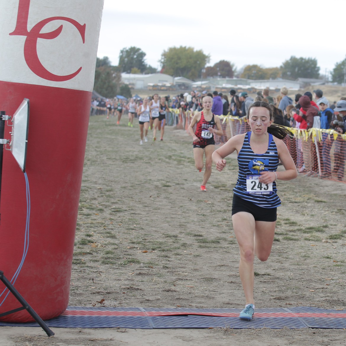 JASON ELLIOTT/Press
Coeur d'Alene senior Olivia May crosses the finish line 11th to earn state medalists honors at the state 6A cross country meet on Saturday in Lewiston Orchards.
