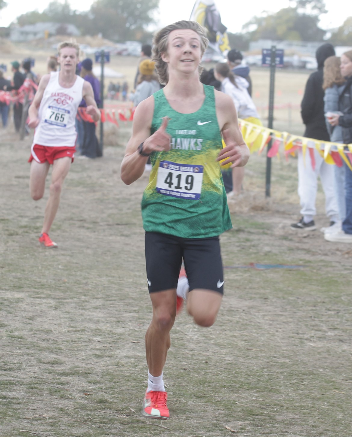 JASON ELLIOTT/Press
Lakeland junior Frank McCarthy takes a lead on Sandpoint's Jack Lovin during the second lap of the state 5A boys cross country race at Lewiston Orchards. McCarthy was 14th, Lovin 16th to earn state medalist honors for finishing in the top 20.