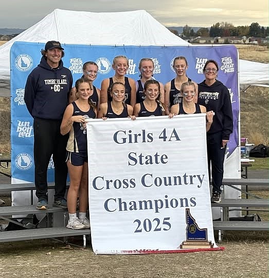 Courtesy photo
The Timberlake girls cross country team won the state 4A title on Saturday at Lewiston Orchards, the program’s first since 2011. In the front row from left are Naomi Dirks, Kenzie Jezek, Addisen Berg and Emily Wright. In the back row from left are head coach Shawn Lawler, Malia Miller, Lola Eggleston, Vanessa McLachlan, Kayla Hyle and assistant coach Jennifer Wenstrom.