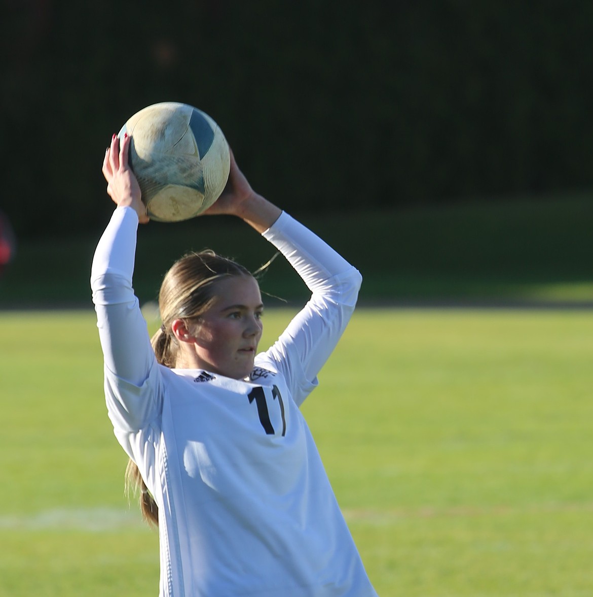 Jill Allred (11) throws the ball back into play against Naches Valley on Saturday. The Knights were defeated 3-0 in the semifinal of the 1A district tournament. They can still earn a spot in the state tournament via the consolation bracket.