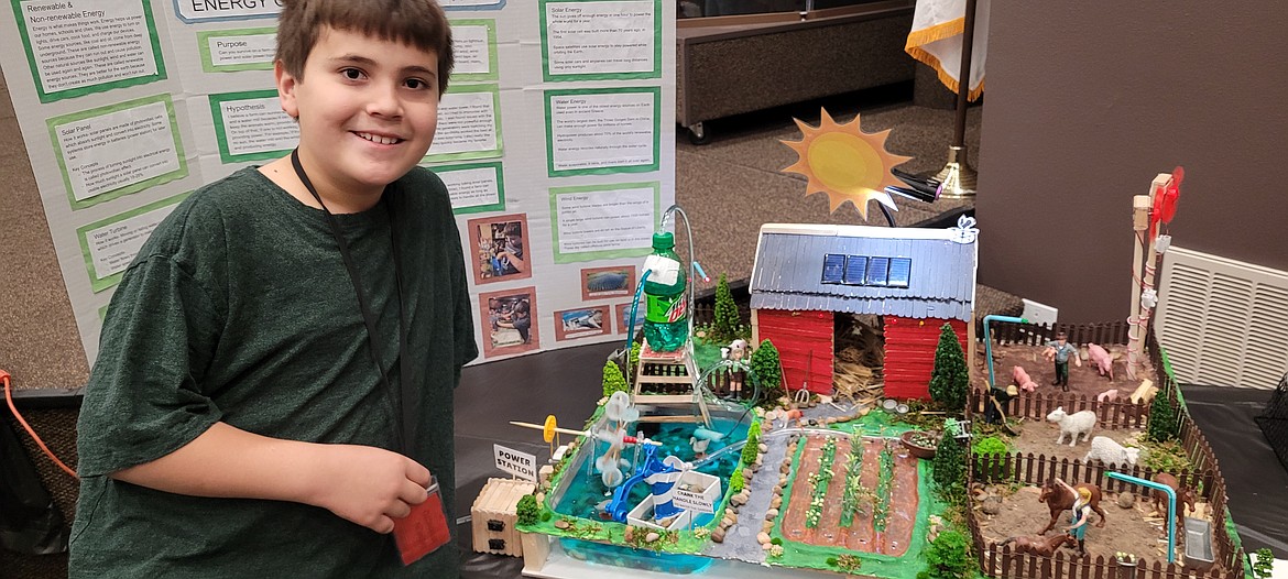Kaemon Miyamoto, 10, took first place for his age category and won the people’s choice award. He made a renewable energy model of a farm. His project contained wind turbines, powered by a fan; solar panels, powered by a flash light; a hand pump that watered the garden; and a water wheel, powered by a power station.
