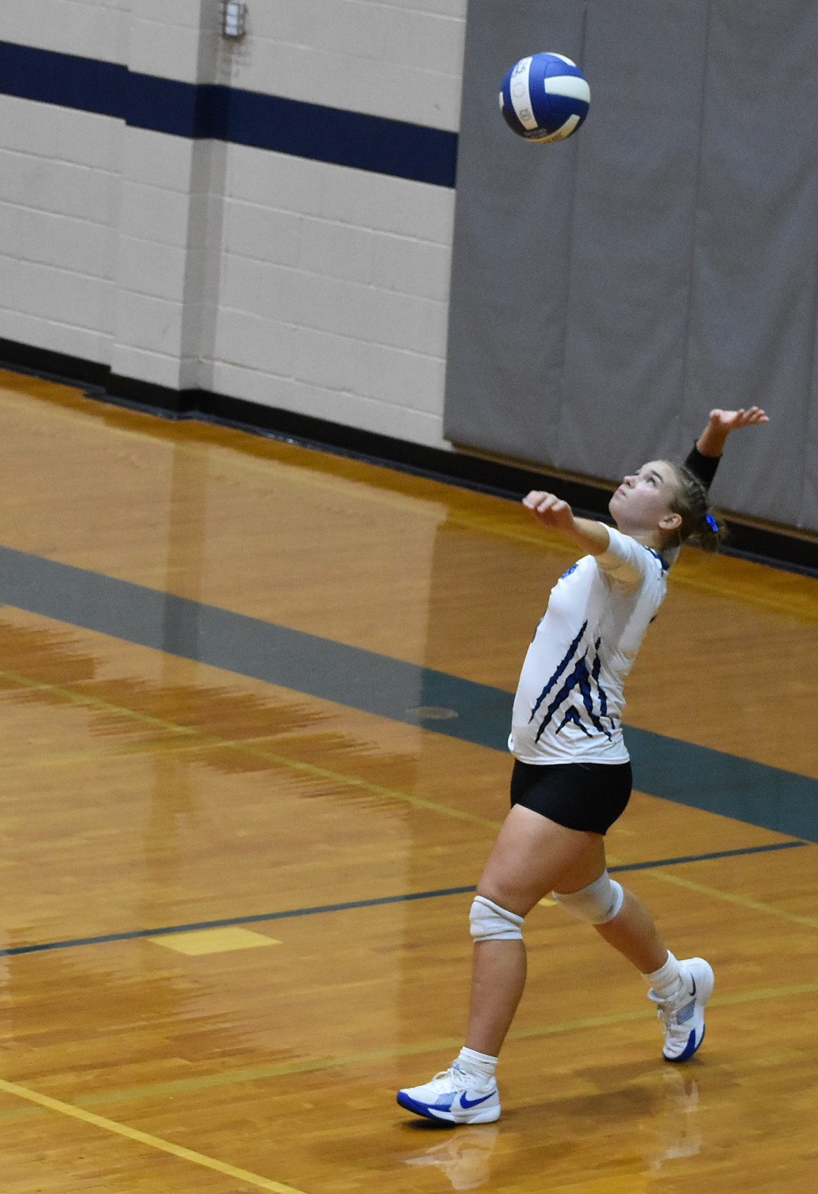 Liana Sushik from the Eagles prepares to serve at a previous home game this season. The Eagles return to the court this week after earning a bye in the district tournament.
