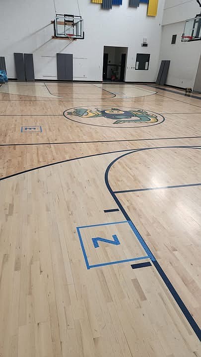 The Groff Elementary gym before the removal of the floor. The Moses Lake School District was able to save the gator, located in the middle of the floor, which it plans to display as a keepsake in the building.