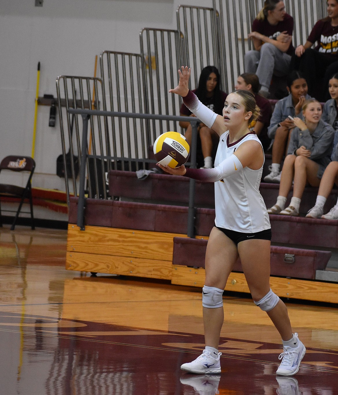 Madison Witwer from Moses Lake prepares to serve the ball during the second set against Eisenhower on Tuesday. Mavs Head Coach Krystal Trammell said the returning players next season will carry on the successes that this year’s seniors pushed for.
