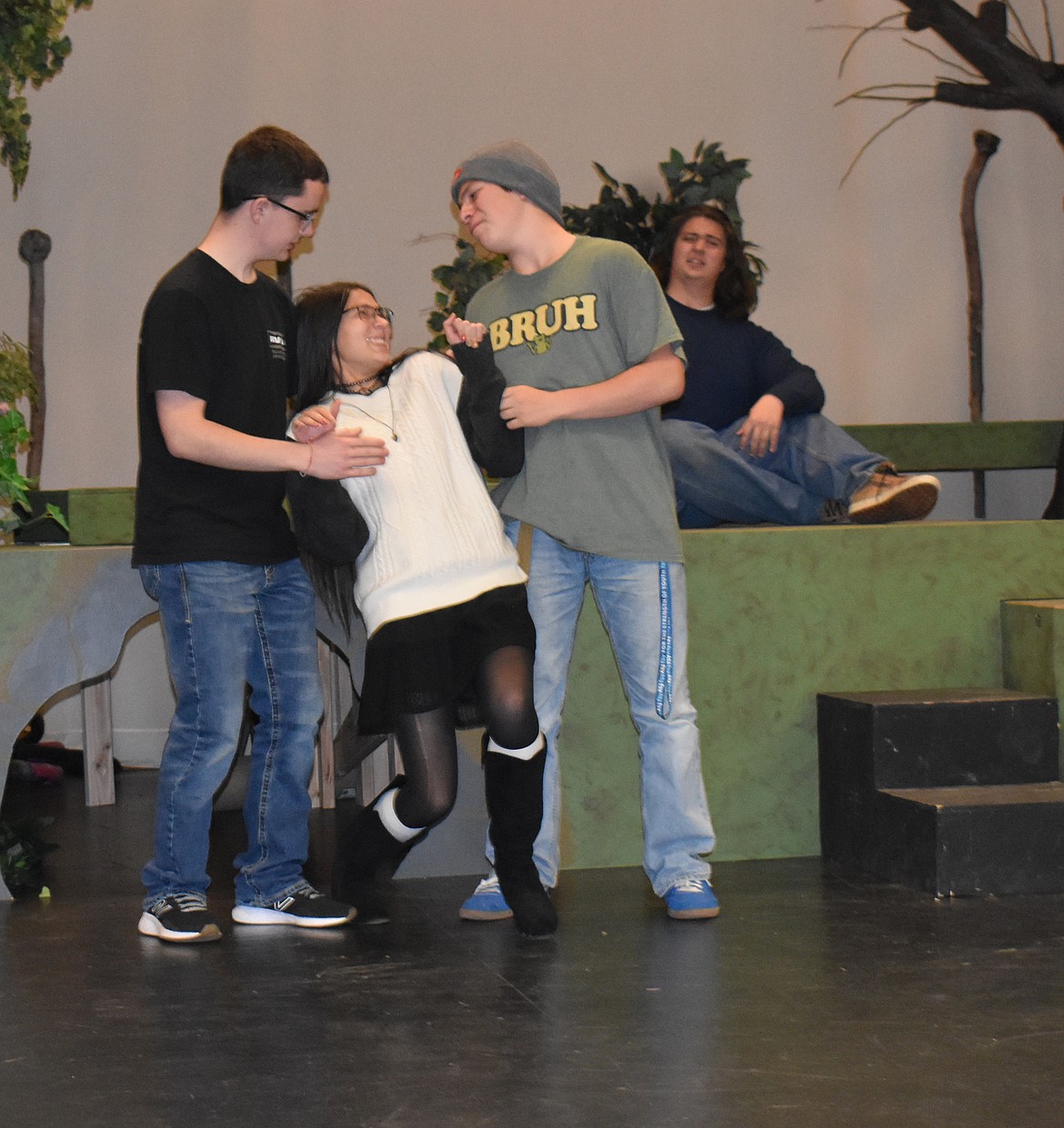 Are Lysander (Sawyer Roylance, left) and Demetrius (Radley Zurligen, right) really both in love with Helena (Arielle Kaminsky), or are they just making fun of her? Nobody’s feelings are to be trusted in the Othello High School production of “A Midsummer Night’s Dream.”