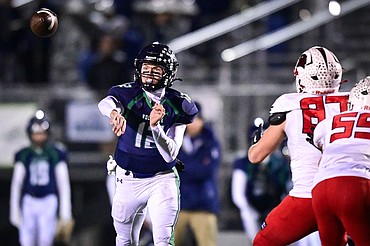 Glacier quarterback Jackson Presley (12) completes a pass to wide receiver Cooper Pelc in the third quarter against Bozeman in the Class AA quarterfinals at Legends Stadium on Friday, Nov. 7. (Casey Kreider/Daily Inter Lake)