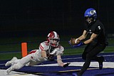 STATE 6A QUARTERFINALS: Pick-6, then pick-3 — Lindquist takes first of his three interceptions the distance as Coeur d’Alene routs Madison, sets up semifinal date with Timberline