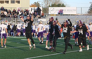 The Mavericks celebrate after securing a 49-35 win at home over Issaquah to advance to the 4A state tournament. The Mavericks’ Theo Kalasountas came up with an interception late in the fourth that led to a game sealing touchdown.