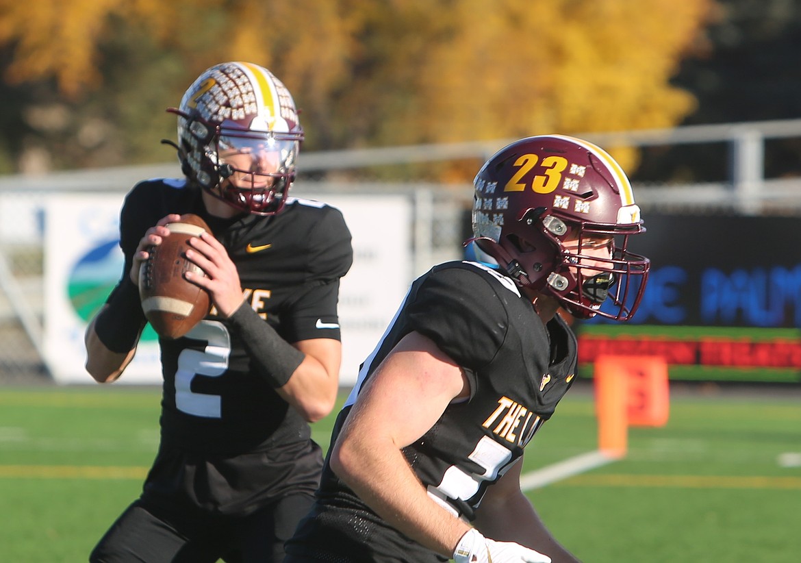 Brady Jay (2) drops back to pass as Elijah Burns (23) steps up to pass block. Burns was productive on the ground thanks to a physical offensive line dominating the trenches on Saturday.