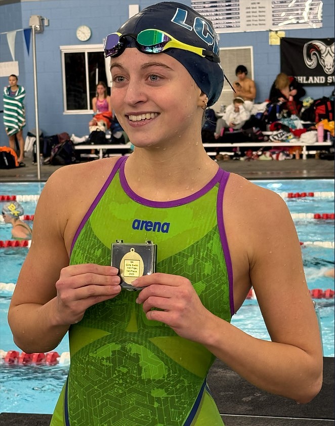 Courtesy photo
Lake City senior Quinn Taylor holds her medal after winning the state 6A title in the 100-yard freestyle on Saturday at the Idaho Central Aquatics Center in Boise.
