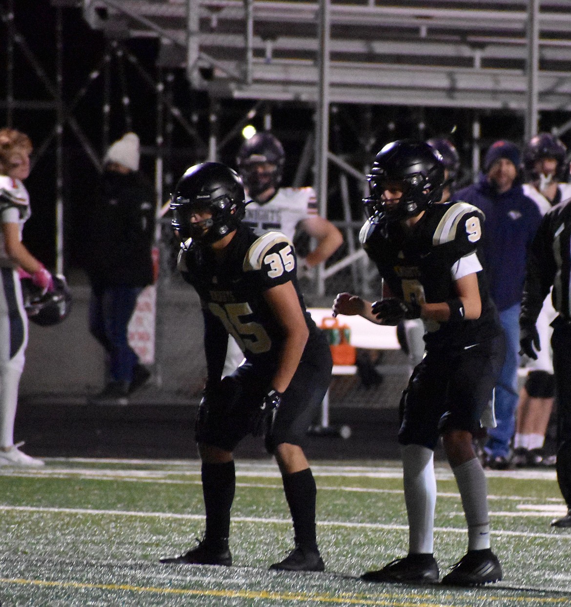 Dane Allred (9) gets ready for the snap during the fourth quarter with senior running back Jose Herrjon (35) standing by, ready to make a run down the middle to run down the clock. The Knights played a dominant game on all sides of the ball, scoring on offense, defense and special teams.