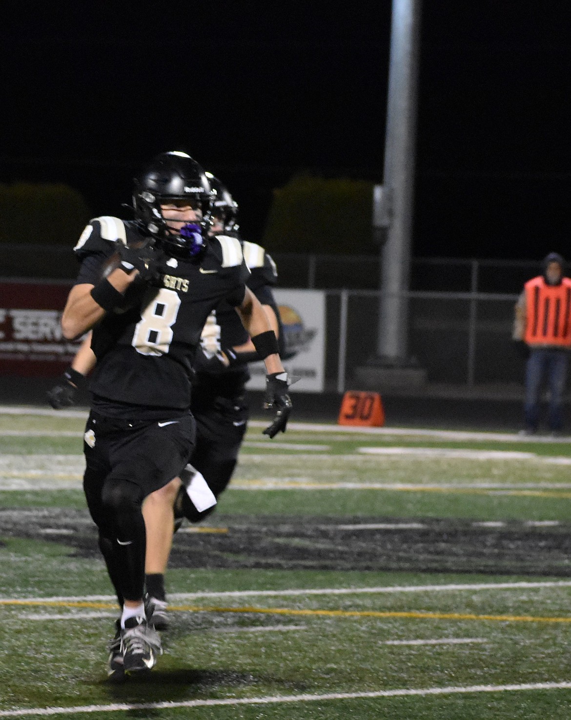 Knights junior Manny Ruvalcaba takes off after intercepting the ball from King’s Way Christian. The Knights defense held their opponent scoreless throughout Friday’s matchup.