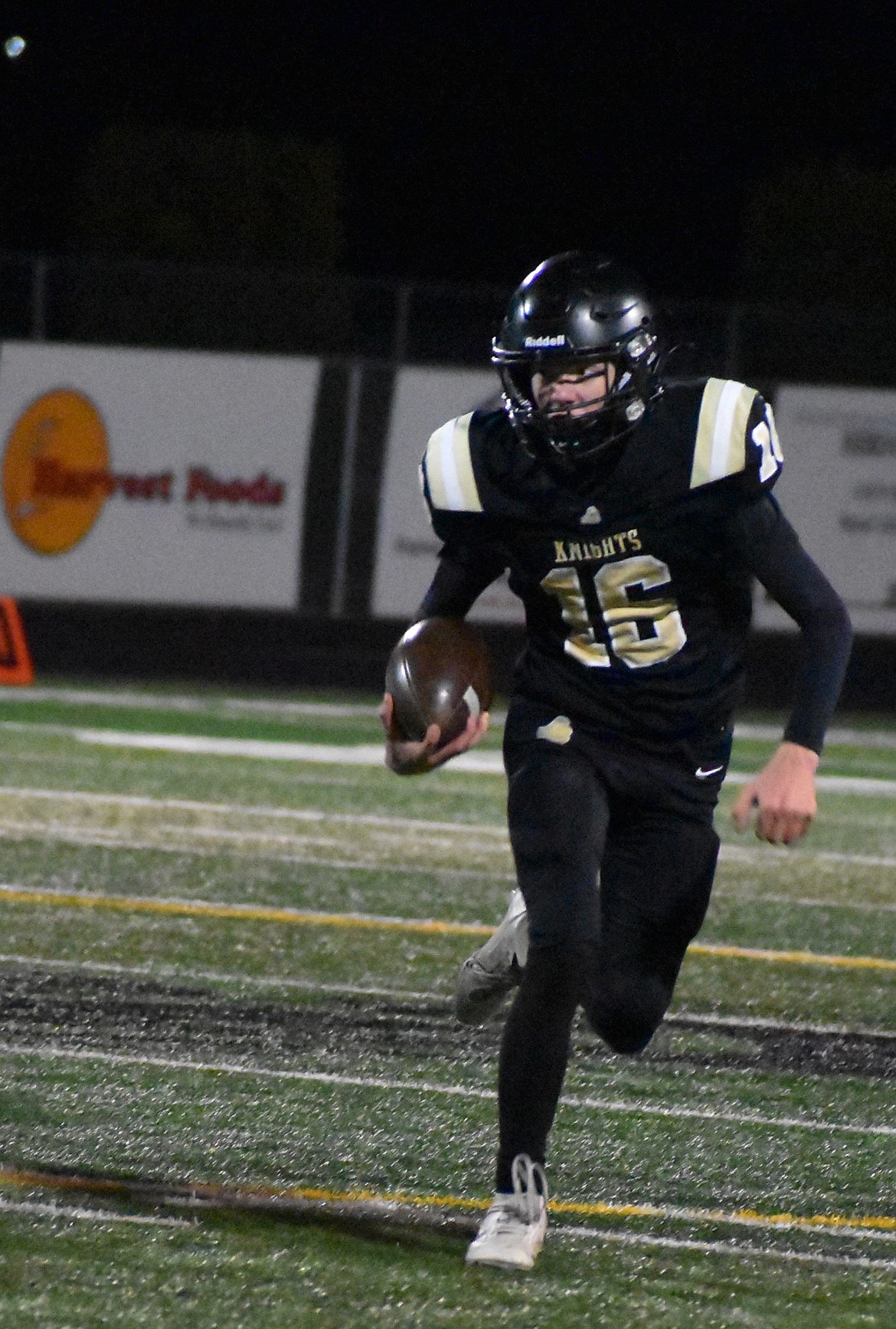 Brycen Fitzhugh from Royal weaves his way past the King’s Way defense to earn a first down late in the game on Friday.