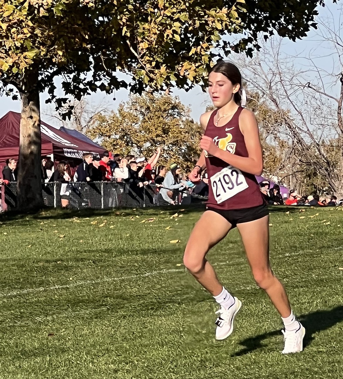 Aspen Hoenes (2192) pushes downhill at the 4A state cross country meet. Hoenes finished in 20th place with a time of 19:11.20.