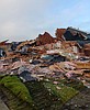 Person with excavator destroys new home