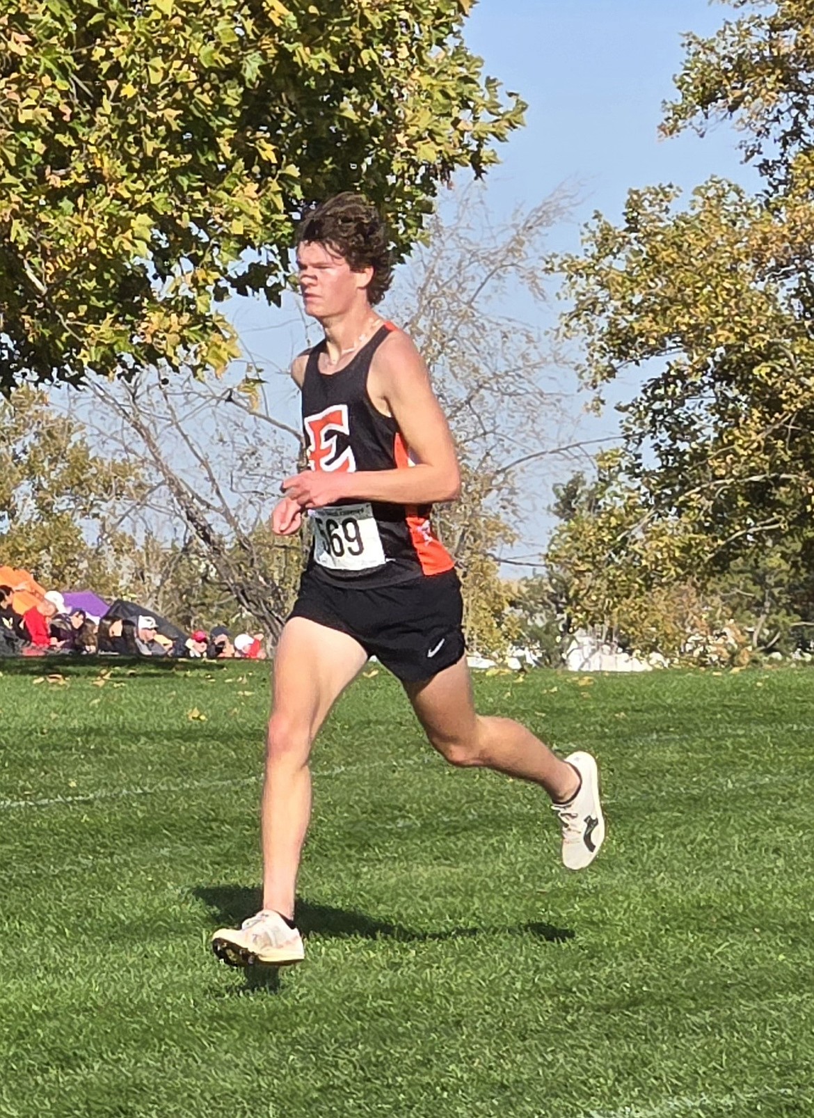 EHS senior Maddax Iverson runs across the grass during the state tournament where he finished with a final time of 17:25.0. This was Iverson’s fourth straight appearance at the state tournament.
