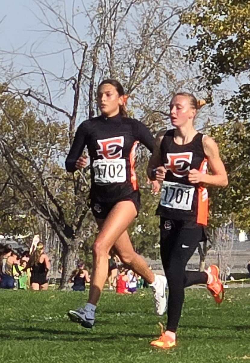 Hannah Malone (1702) and Savannah Harper (1701) run together during the state tournament. Malone finished with a time of 20:32.4 and Harper finished with 20:35.1.