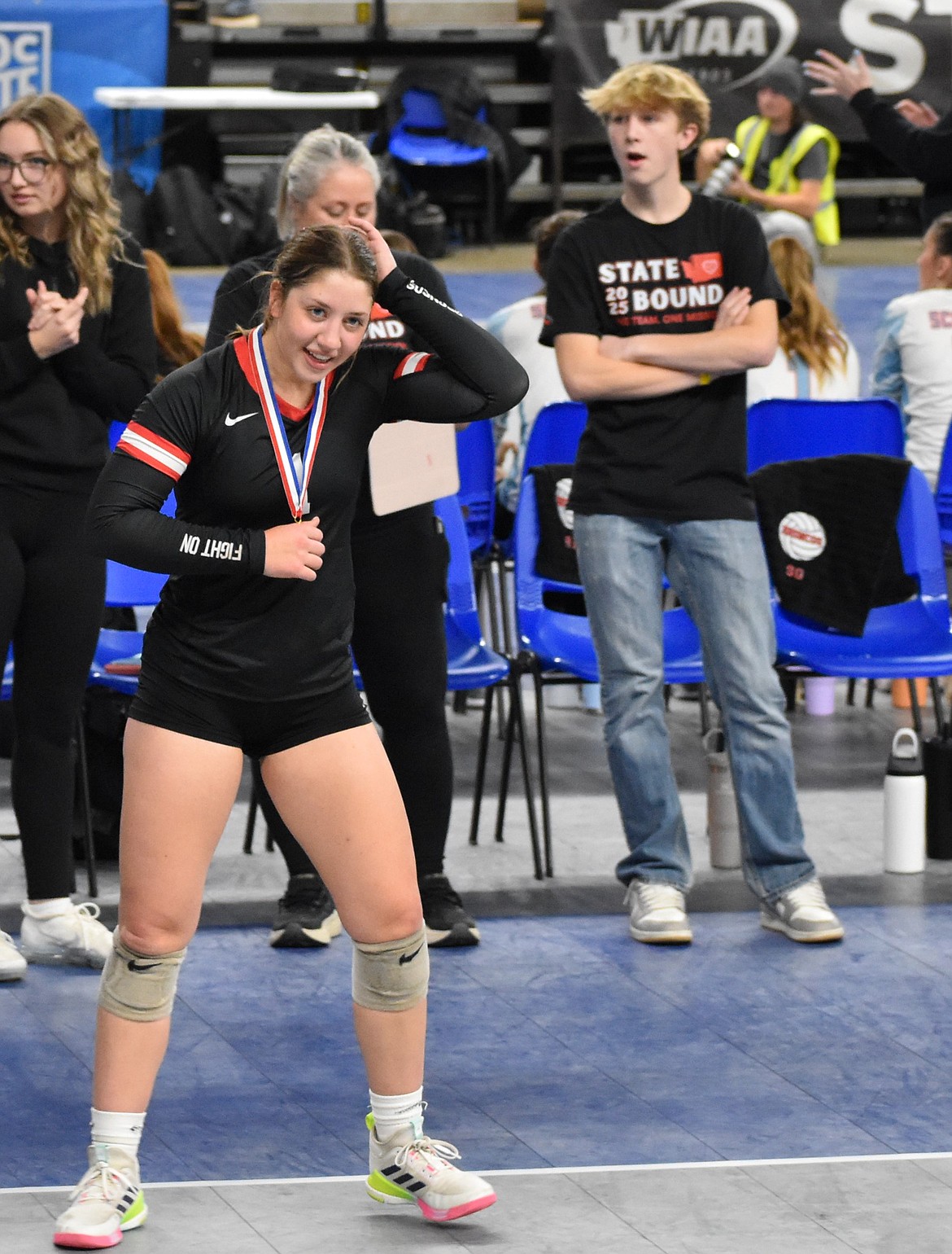 Senior for the Broncos, Zoe Galbreath makes her way back to her teammates after earning the sportsmanship award in the team’s win against Kittitas.