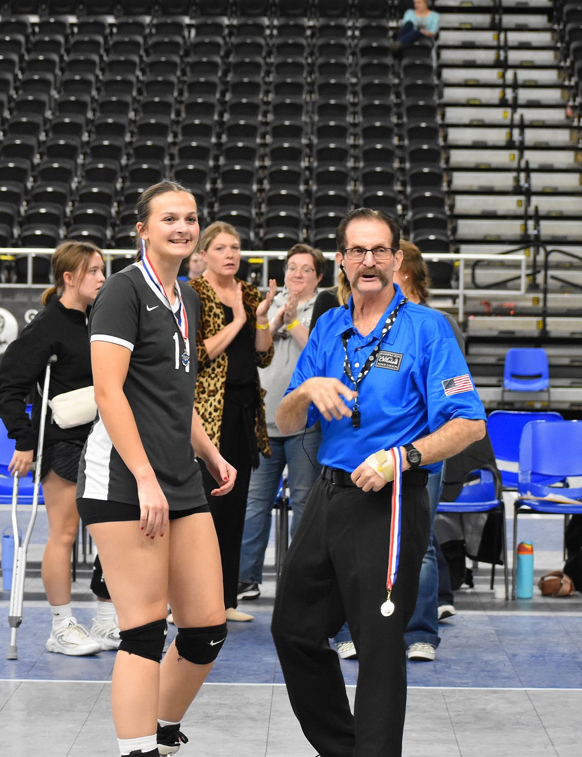 Peyton Roberts (11) receives her medal for sportsmanship after a state tournament game.