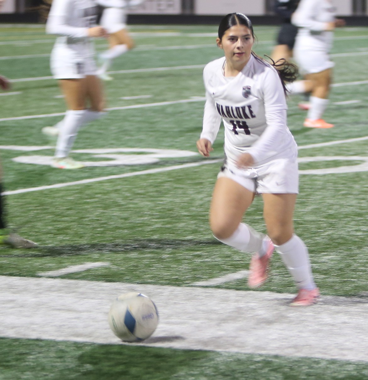 The Wahluke Warriors’ Alexandra Rodriguez (14) looks for a passing opportunity against the Knights in the 1A district tournament.