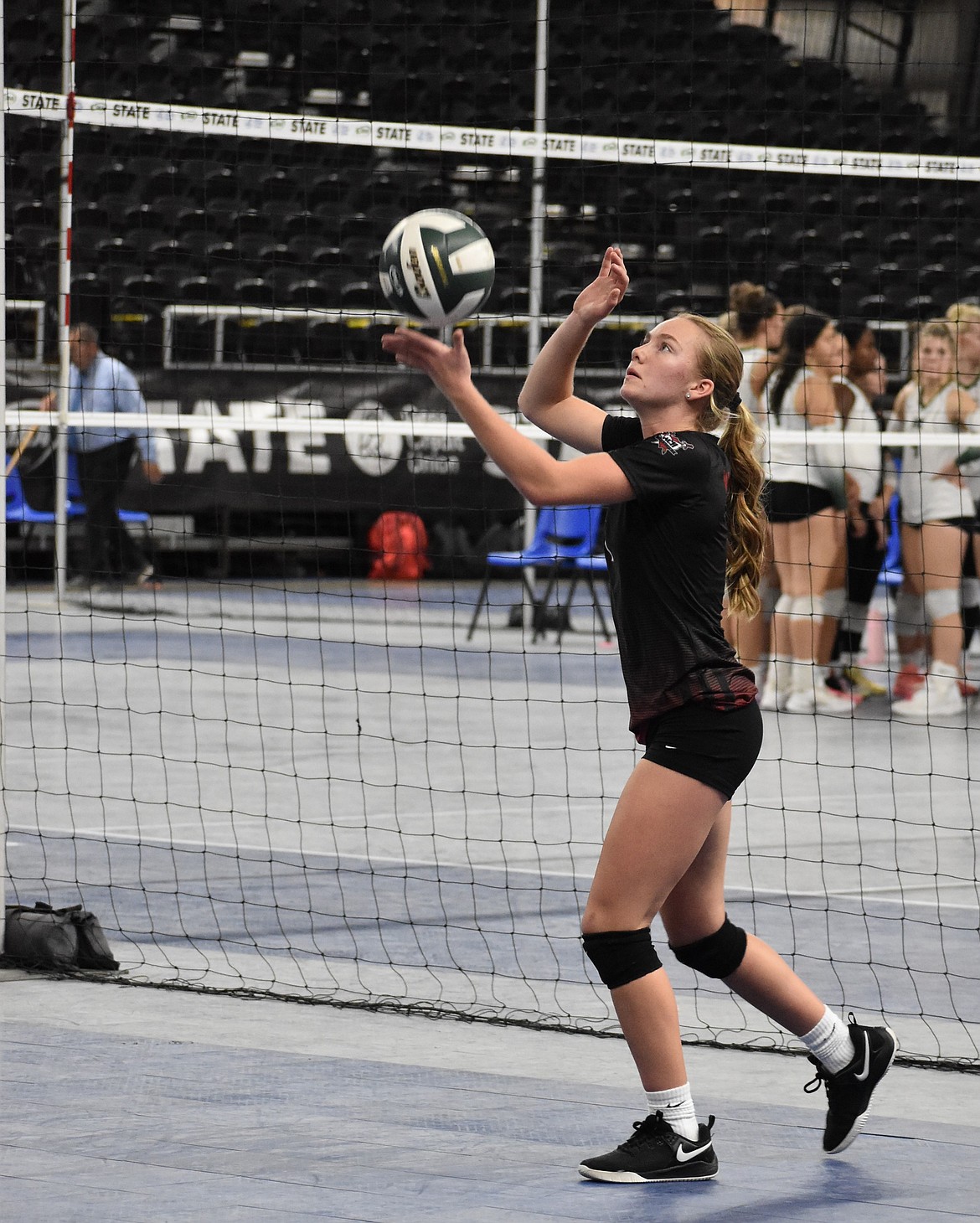 Naomi Molitor, a senior for ACH, gets ready to serve the ball during the third/fourth place game against Oakesdale. Molitor said the team came into the tournament with high hopes and is proud of how hard they fought to reach their goals.