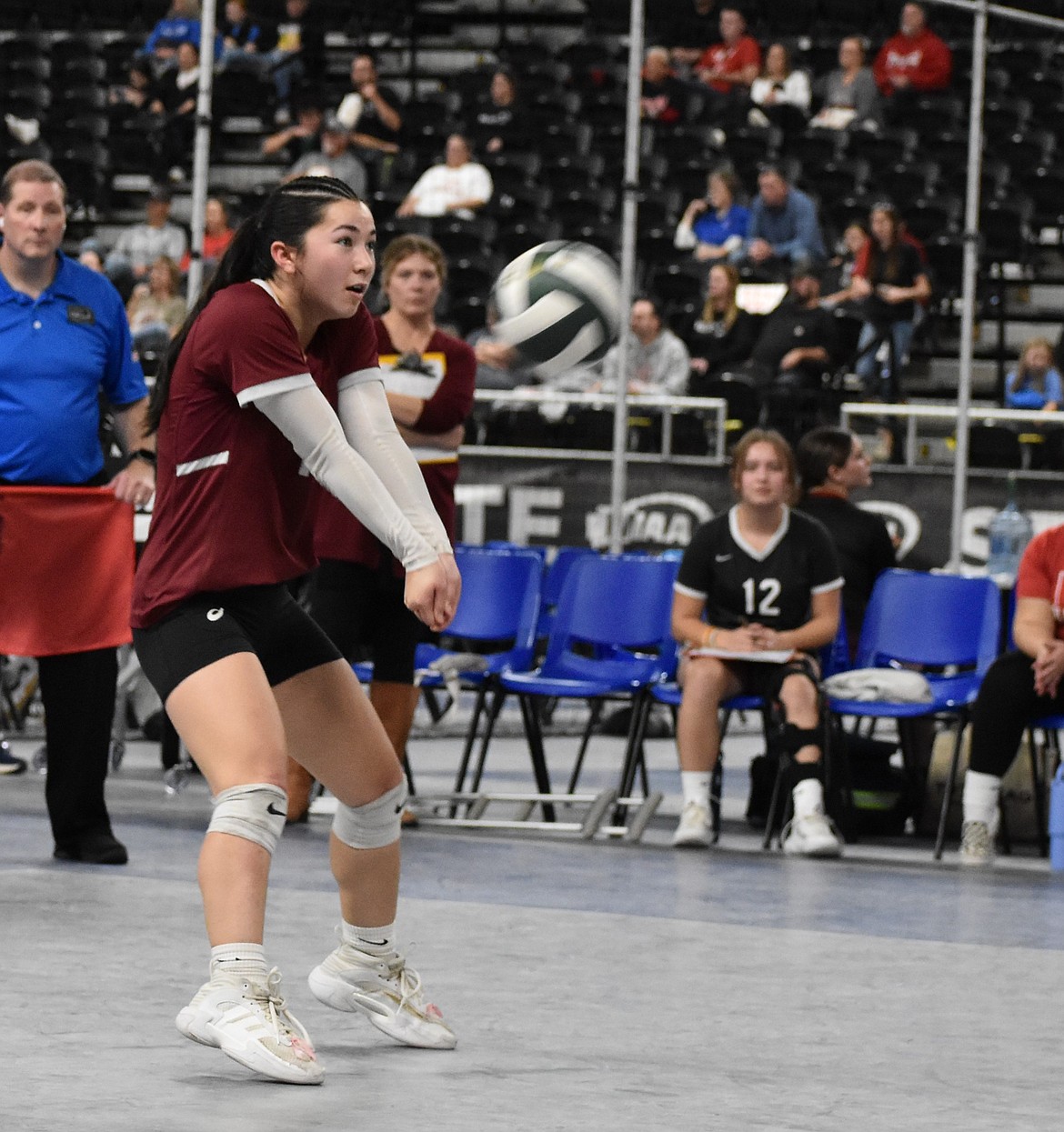 Warriors junior player Grace Okamoto hits the ball back over to Darrington in their second-round victory in the state tournament.