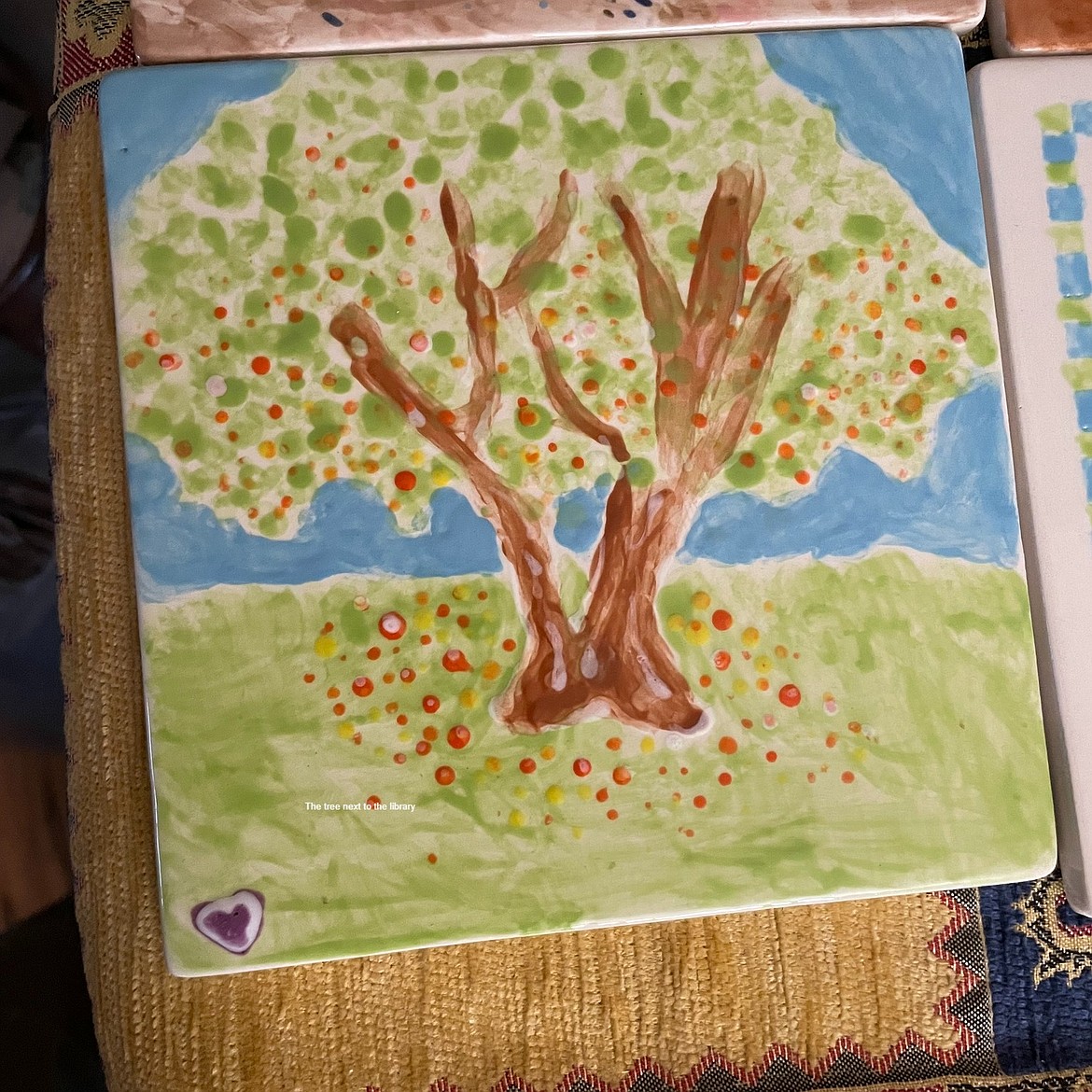 One artist painted the tree found behind the Soap Lake Library at the last tile mural project class.