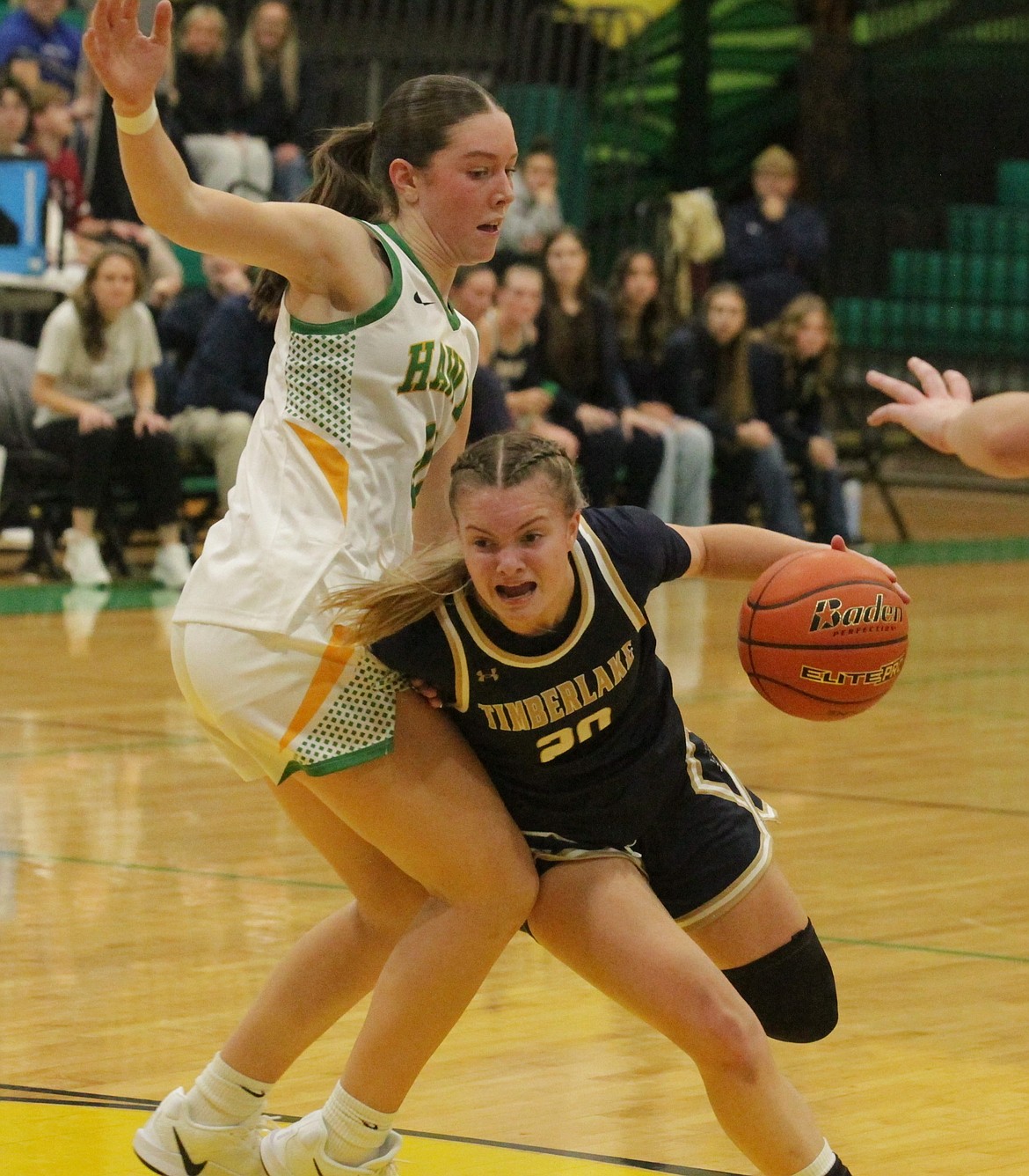 MARK NELKE/Press
Timberlake senior Malia Miller (20) drives as Lakeland freshman Jaeli Hoffman defends on Thursday night at Hawk Court in Rathdrum.