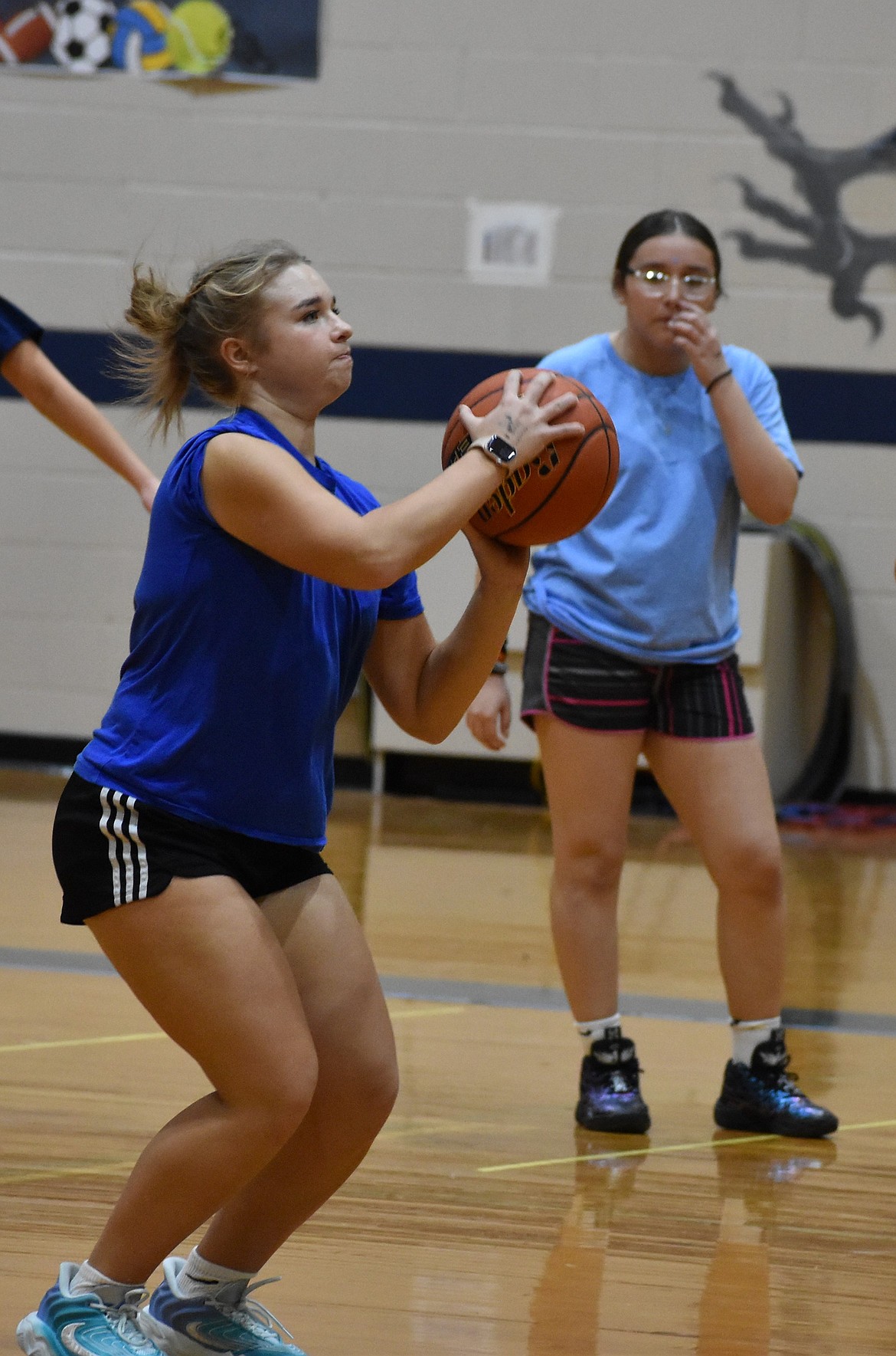 Liana Sushik, a senior for the Eagles, prepares to make a shot at practice during the preseason. Last season Sushik had a career high seven three-pointers made in a single game.