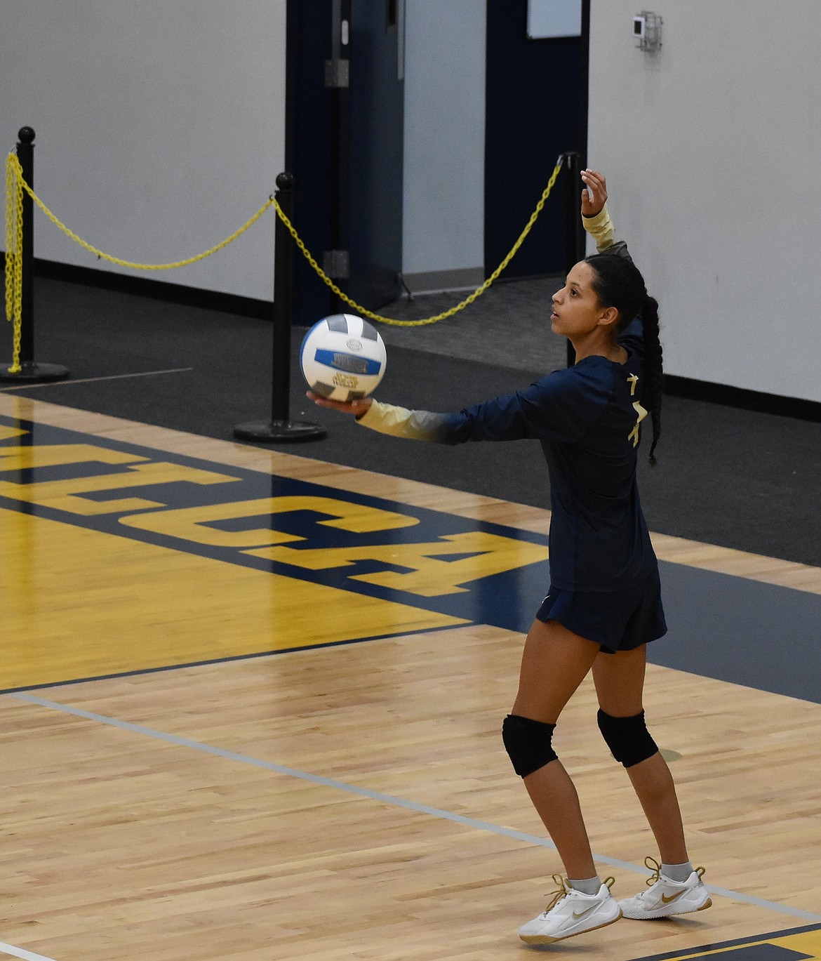 Lions senior SanTahna Ferguson prepares to serve during a game early in the season. Lions Head Coach Dean Spurbeck said Fergson was a great member of the team and will be greatly missed next season.