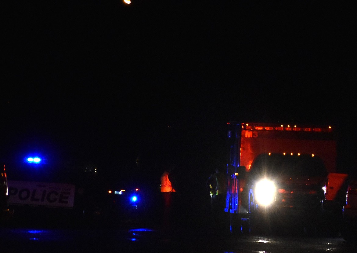 Emergency Medical Services help load the victim into the ambulance to be transported to the hospital while the Moses Lake Police Department works to reroute traffic.