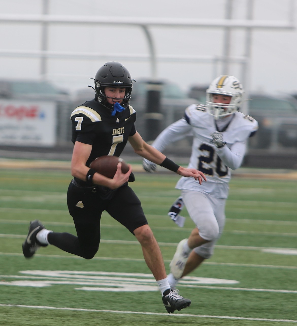 The Knights’ Grant Wardenaar (7) breaks out of the pocket on a designed run play against Seton Catholic. Royal defeated Seton Catholic 48-10 to advance to the 1A state football tournament semifinals where they will host Lynden Christian.