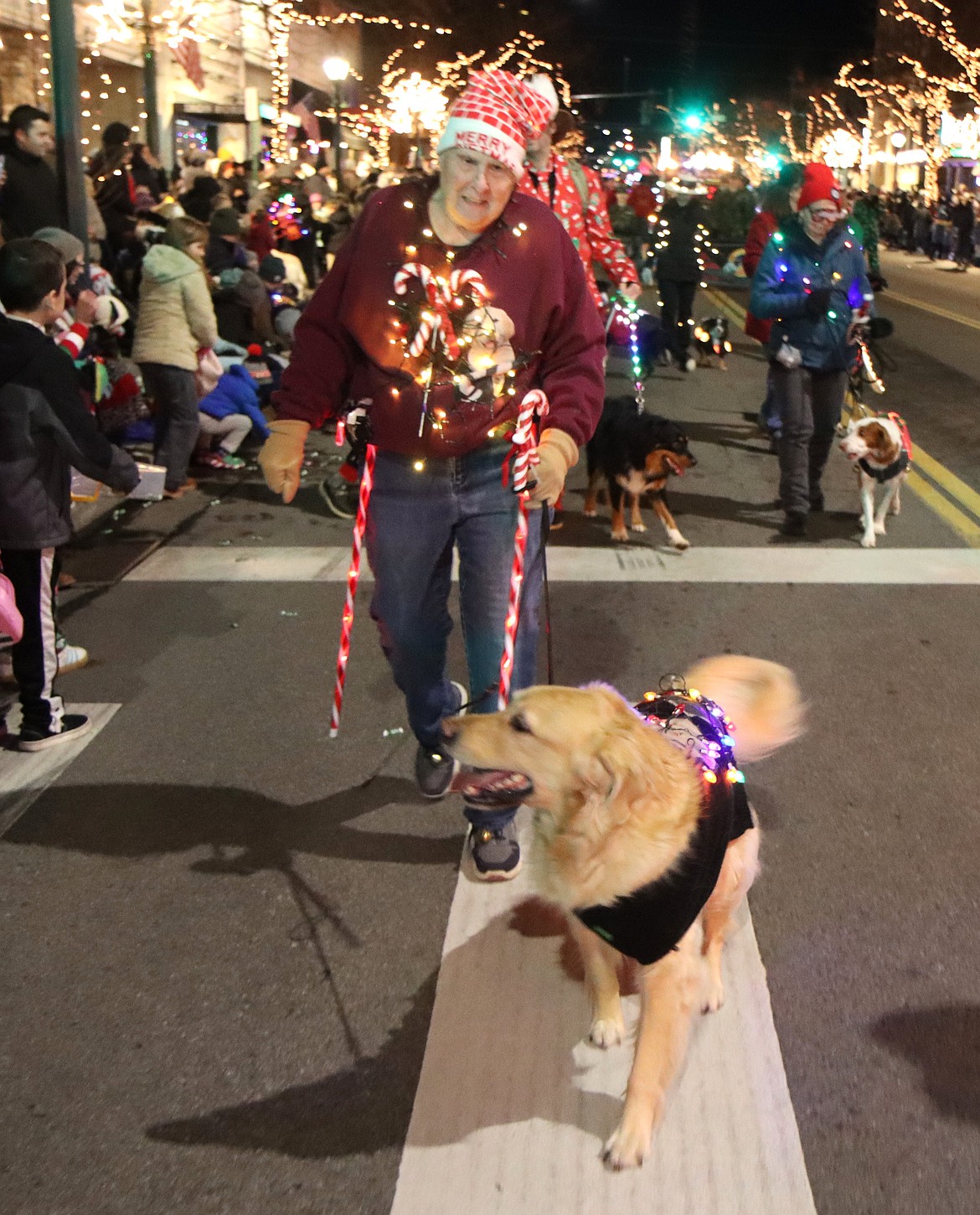 Carol Cook and her canine Maggie greet the crowd.