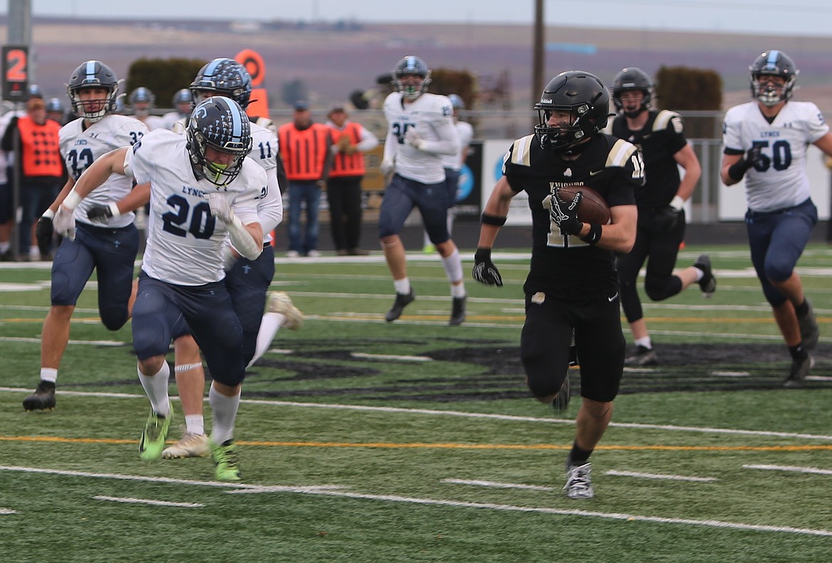 Fischer Livingston (12) outruns a Lynden Christian defender during their 1A semifinal game on Saturday. The Knights will face the Cashmere Bulldogs for the second time this season, this time for the state championship.