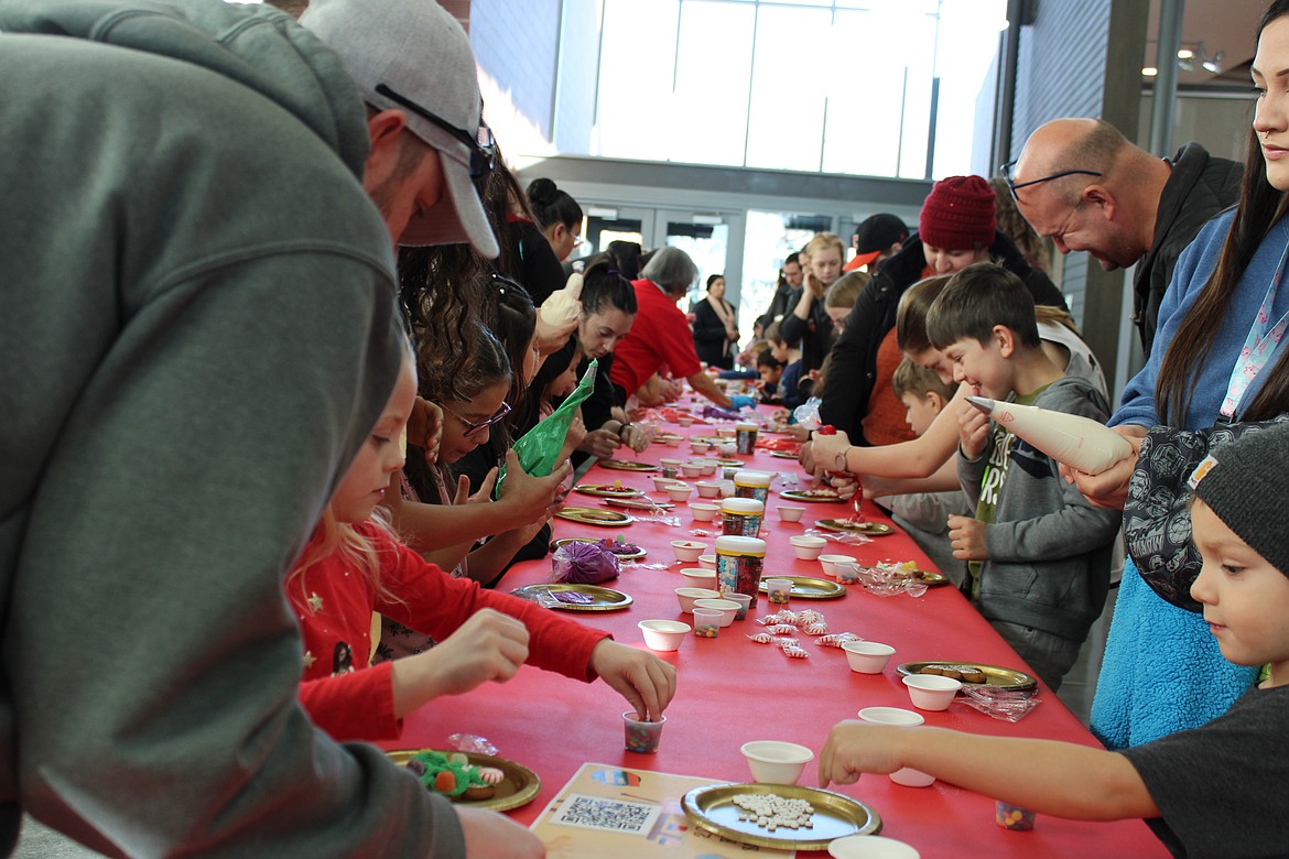 Children decorate holiday cookies at the Moses Lake Museum & Art Center’s Free Family Saturday. The museum will host cookie decorating again this week.