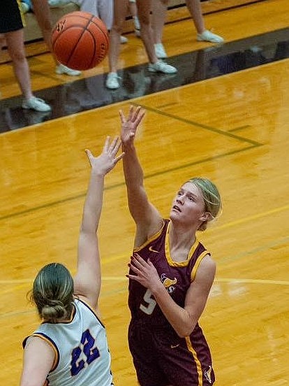 MLHS senior this season, Addyson Burns, takes a shot at the basket through an opposing defender last season. Head Coach Matt Strophy said Burns will be a key player on the team this season as she has worked as a leader to push the team in the right direction.