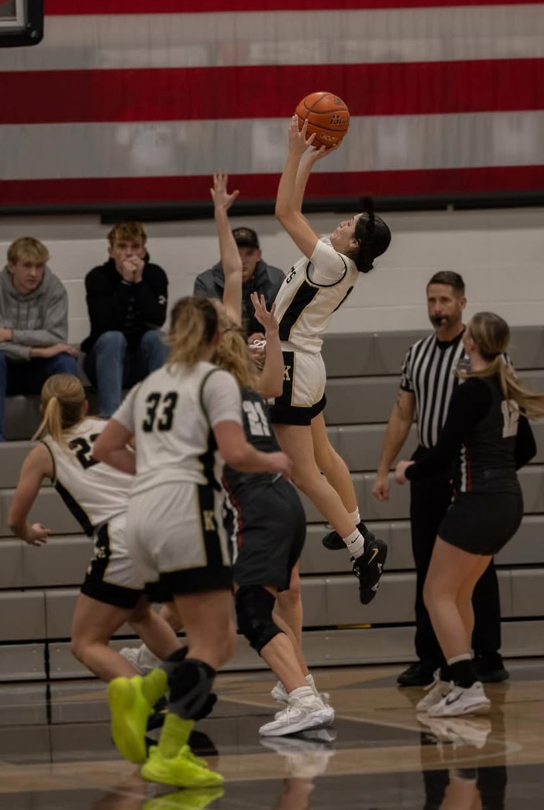 The Knights’ Briana Cedillo, jumping, puts up a contested shot over a defender during a game last season. Head Coach Farrah Wardenaar said the Knights have a shared goal of reaching the state tournament this season and making a deep run.
