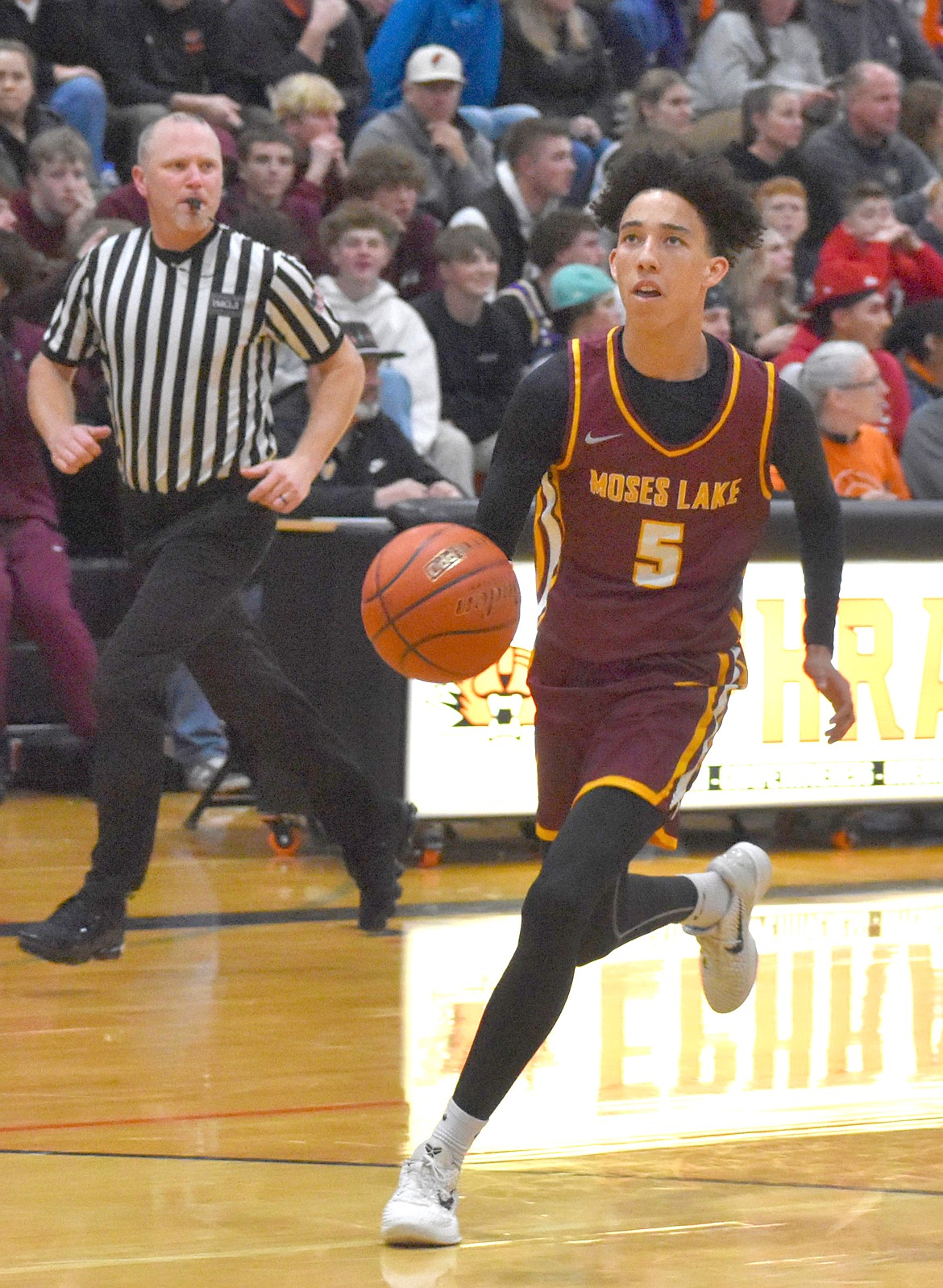 Mavs senior Tyce Miller finds himself an open court to make a layup with the Tigers defense behind him.