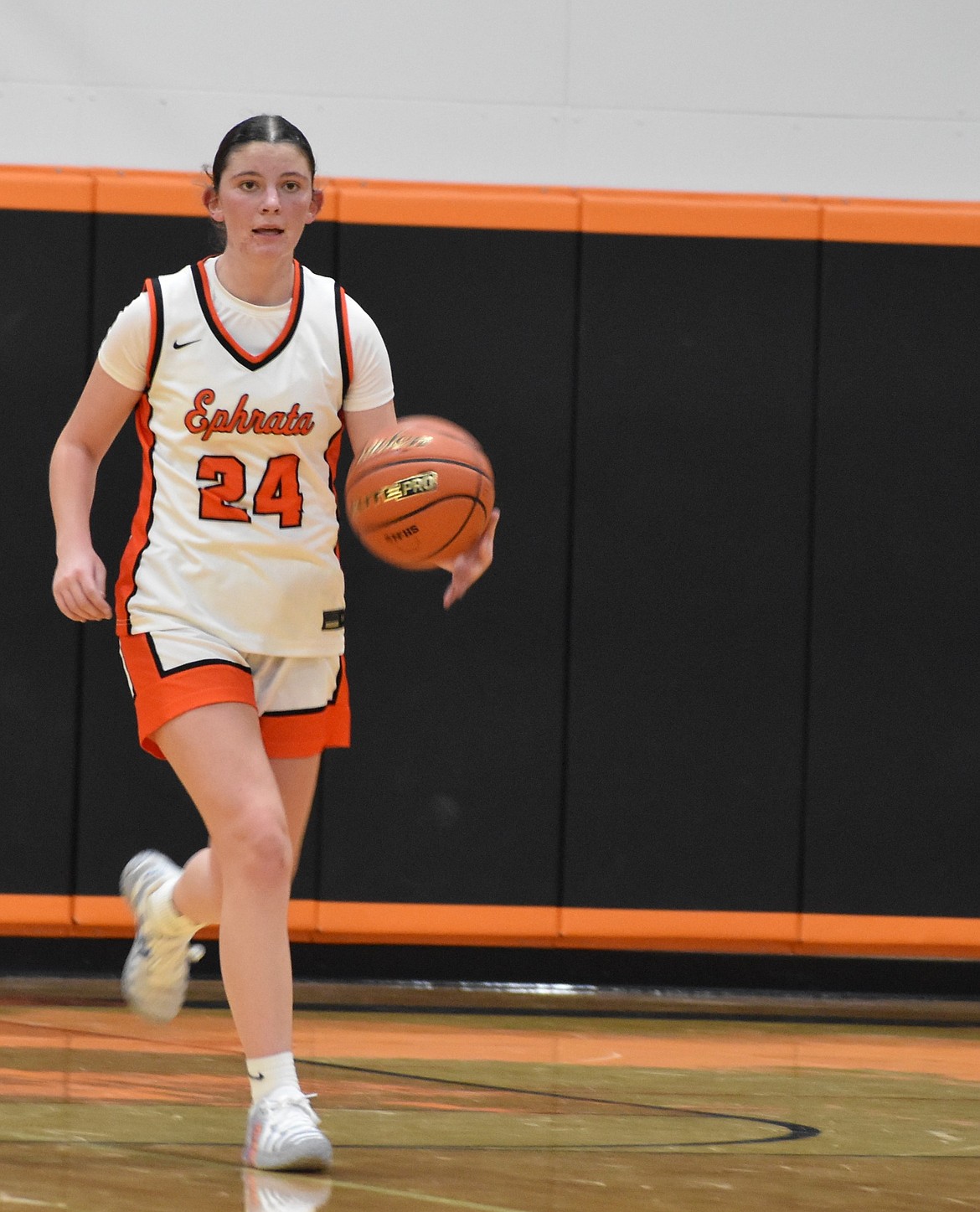 Maycee Black, a freshman for the Tigers, plans her next move as she makes her way down the court after gaining possession of the ball during Tuesday’s game against the Mavs.