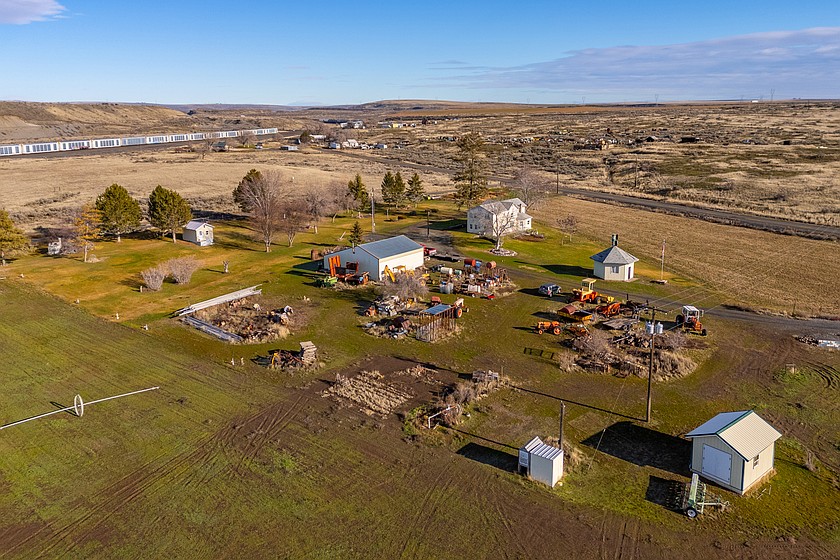 This 25-plus-acre mini-farm east of Soap Lake includes a three-bedroom house, two outbuildings with electricity and heating systems, and a 1,500-square-foot shop.