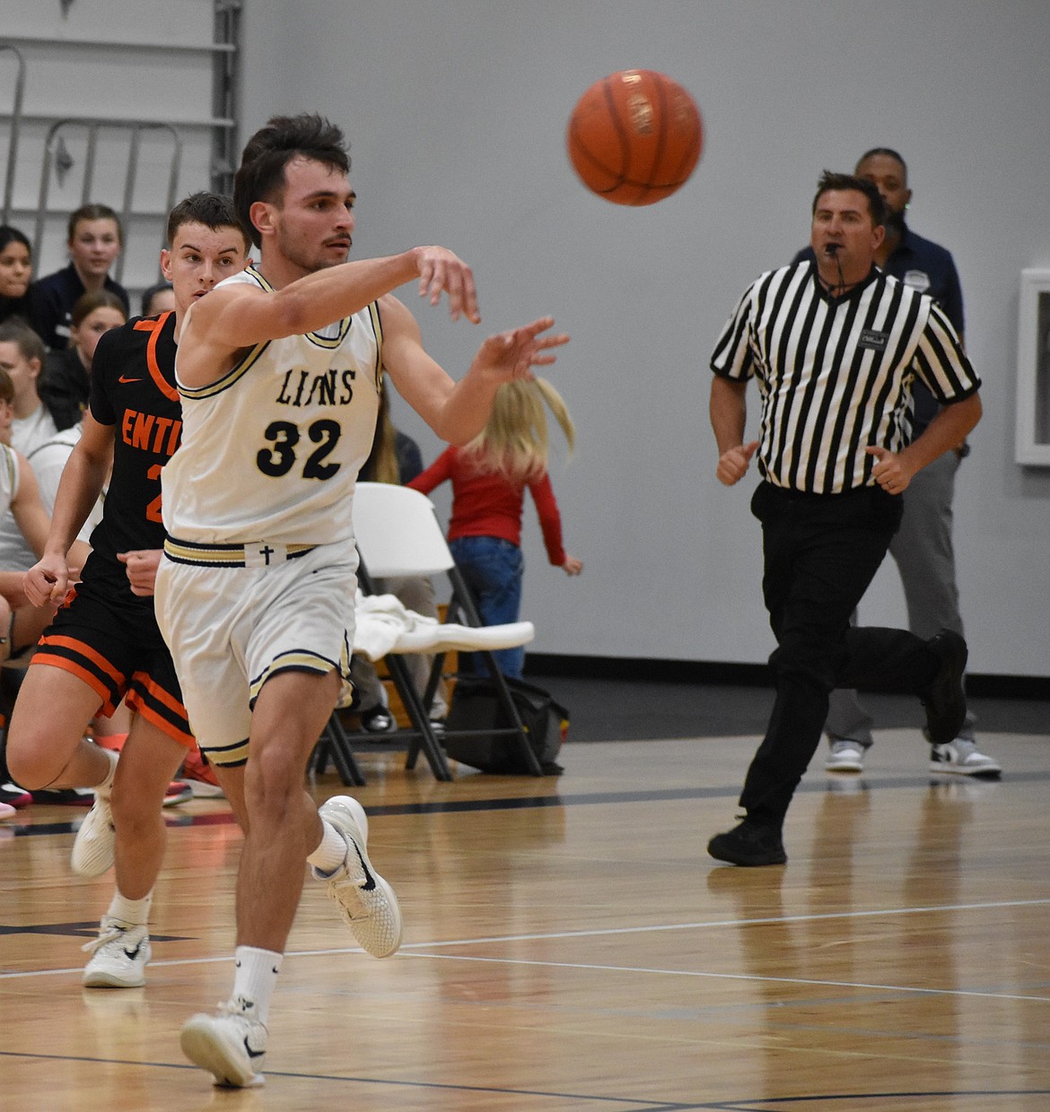 Lions senior Dennis Gulenko passes the ball to a teammate during Wednesday’s matchup.