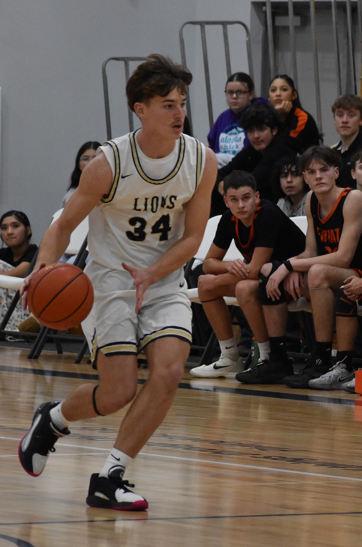 Lions junior Kevin Jorgenson rushes down the court after taking possession of the ball from Entiat during Wednesday’s game.