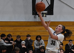 Freshman Shay Kast from the Lions goes in for the layup during Wednesday’s matchup against Entiat. Kast was an offensive force throughout Wednesday’s game.