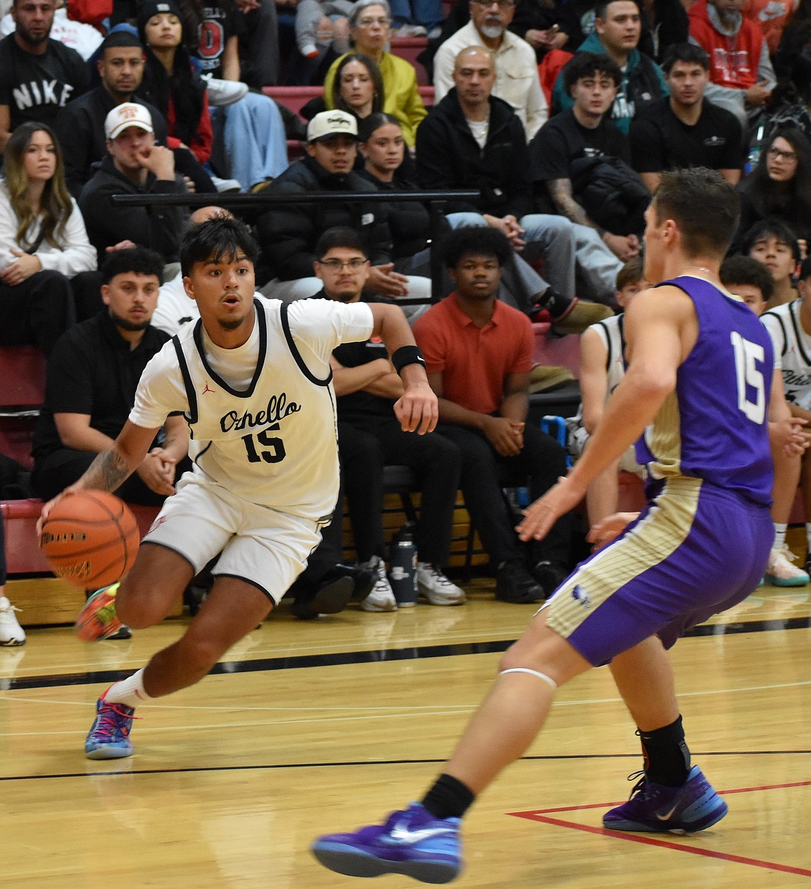 LJ Nunez, a sophomore for OHS, quickly moves down the court and works to maneuver around a Connell defender Thursday.