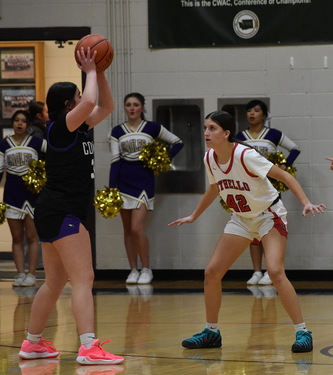 Othello freshman Suzzie Henley guards against a player from Connell as the opposition makes an offensive push.