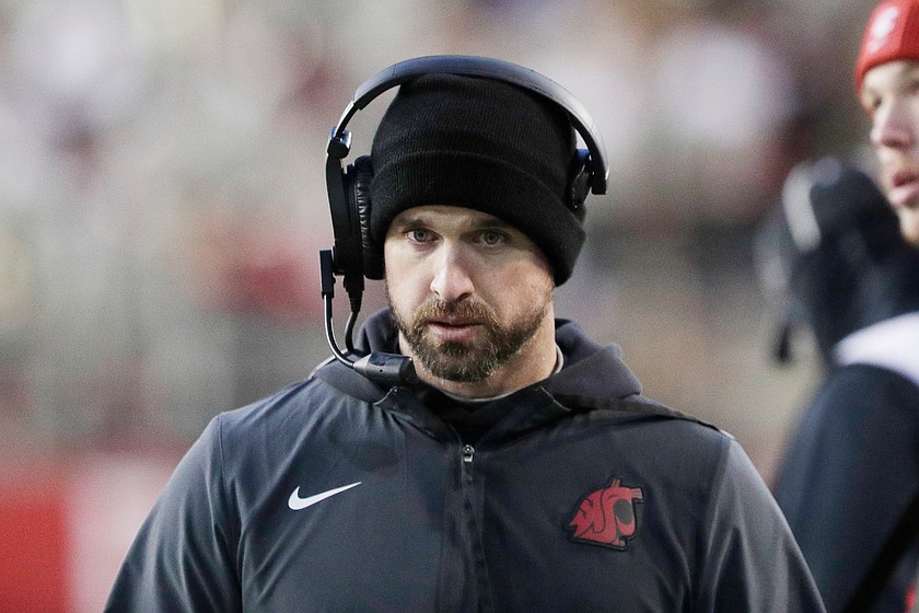 Washington State head coach Jimmy Rogers walks on the sideline during the first half of an NCAA college football game against Oregon State, Saturday, Nov. 29, 2025, in Pullman, Wash.