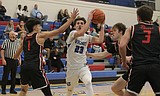 PREP BOYS BASKETBALL: Whittaker shines as Vikings ease away from Moscow