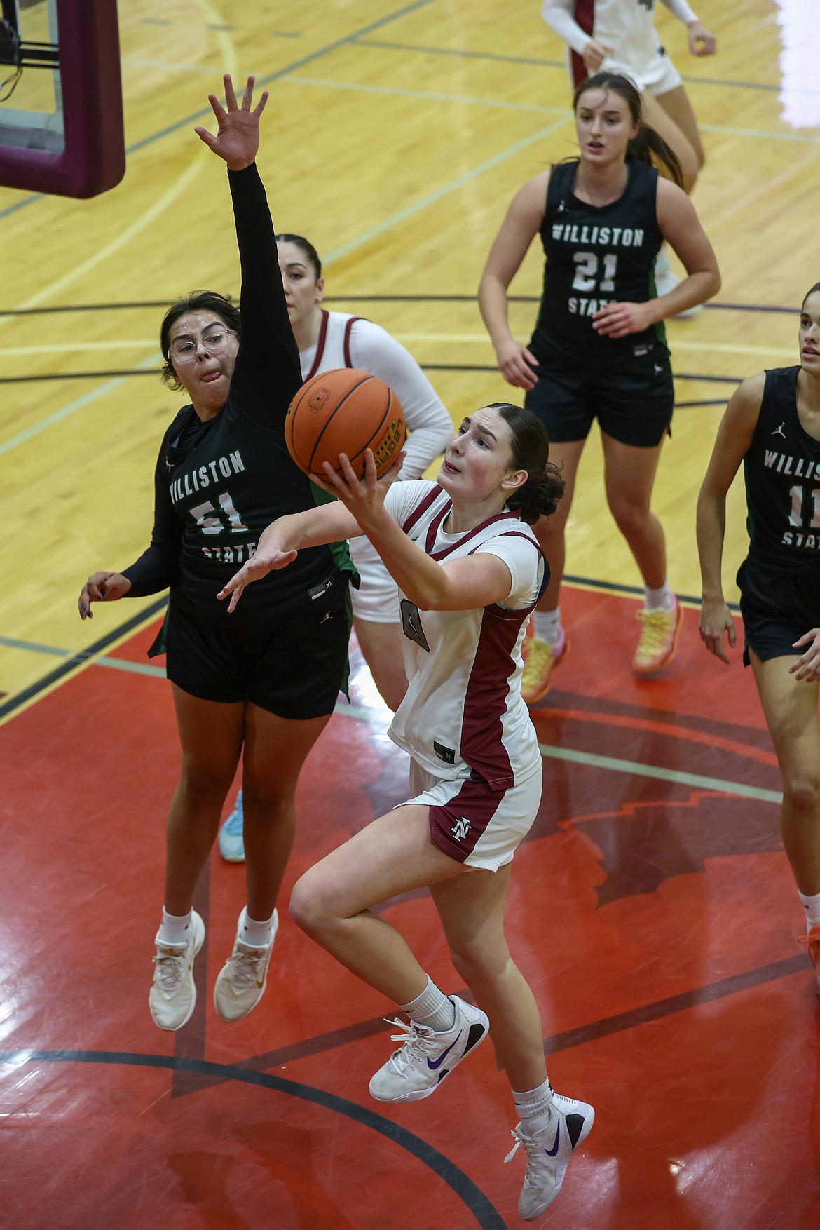 KYLE DISHAW PHOTOGRAPHY
North Idaho College sophomore guard Chloe Collin drives to the basket as Williston State's Emily Fixico (51) defends during Saturday's game at Rolly Williams Court.