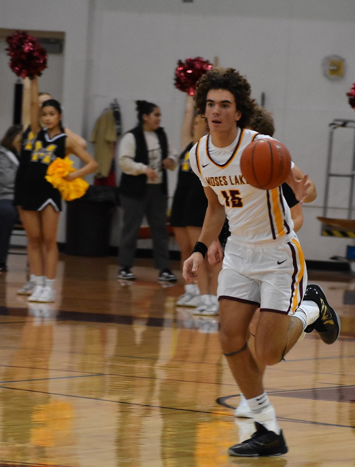 Grady Walker, a senior from the Mavs takes the ball down the court toward the hoop after gaining possession of the ball during Friday’s game against Ferris.